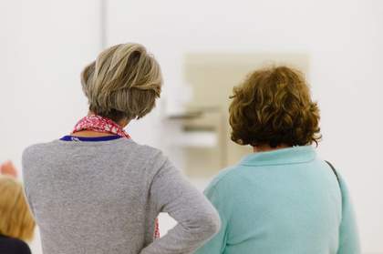 Image of two womens backs