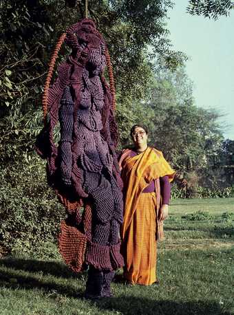 Mrinalini Mukherjee with her jute sculpture, Woman on a Swing, 1989