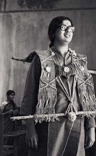 Mrinalini Mukherjee wearing one of her fibre works in 1969, photo by Jyoti Bhatt