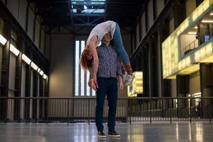 Two dancers on the bridge in the Turbine Hall of Tate Modern