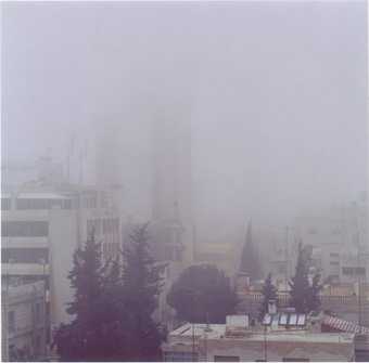 Amman in the snow, Jordan series photograph from Nahnou Together exhibition at Tate Britain, hazy image of the sitting skyline