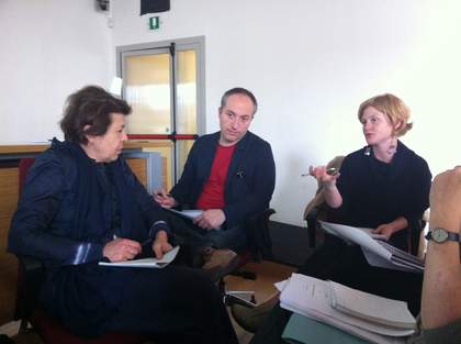 Four people sitting in a circle and in a discussion