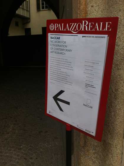 A sign on a board advertising the NeCCAR conference