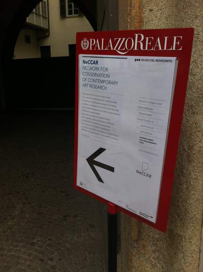 A sign on a board advertising the NeCCAR conference