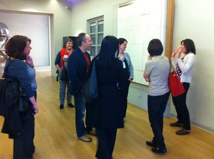 A group of people in the gallery at the Museo del Novecento in Milan