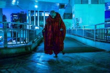 A red-robbed monk walking in Tokyo