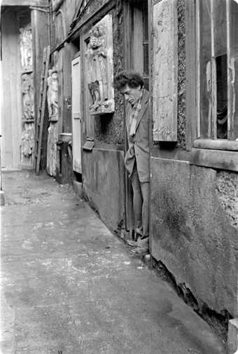 Giacometti in the entrance of his studio, ca. 1950