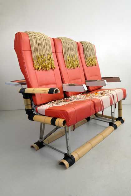 Airline passenger seat covered with material