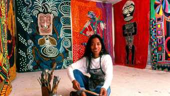 Pacita Abad in her studio with the Masks from Six Continents commission for the Metro Center, Washington, D.C., 1990