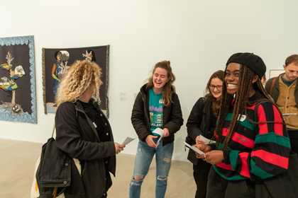 A group gathered in a gallery space