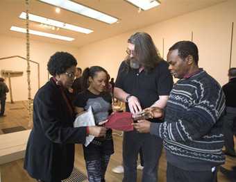 Participants working with an artist during a community education session at Tate Modern