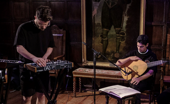 Performance at Sutton House, man playing synth nect to a man playing a mandolin