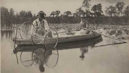 Black and white image of a painting of two people on a boat on a lake