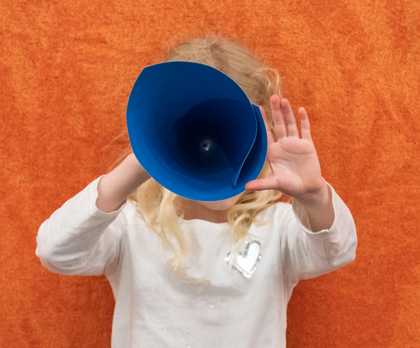 Girl looking through a conical viewfinder