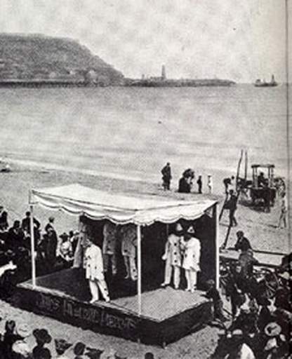 Pierrots on the beach, c.1910