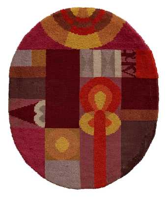 An oval rug with red and orange coloured shapes 