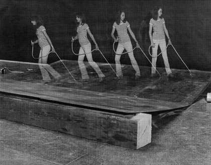 Photograph of visitor pulling a rope in Robert Morris, Tate Gallery, 1971