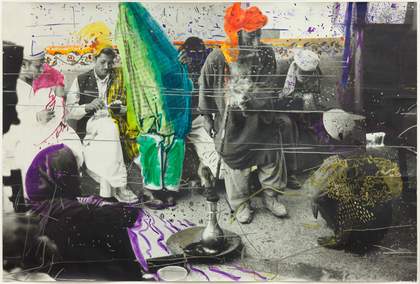 Black and white photograph of Pakistani men sitting in a room, with colourful felt tip markings over the top