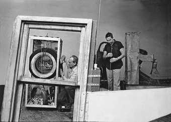 Rauschenberg and Billy Klüver working on 'Oracle' 1962–5 in Rauschenberg's Broadway studio, New York, 1965