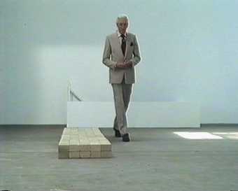 Raymond Baxter with Carl Andre’s Equivalent VIII in Upholding The Bricks, screened in 1991