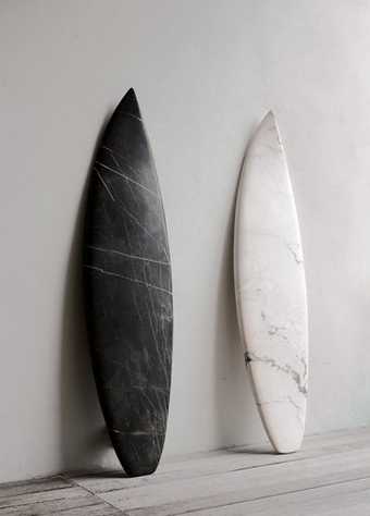 Reena Spaulings The Belgian Marbles Marble Portoro and Marble Rosa Portogallo 2009 two carved peices of marble one black one white leaning against a gallery wall