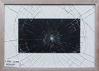 Regular cobweb breakage pattern of standard low reflective glass fitted in frame with window mount