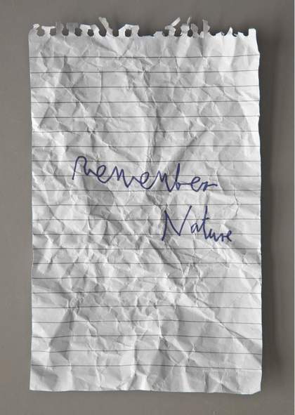 A handwritten note saying 'Remember Nature' on a crumpled page torn from a spiral notebook. This is an artwork by London Fieldworks with Gustav Metzger. The handwriting is by Gustav Metzger.