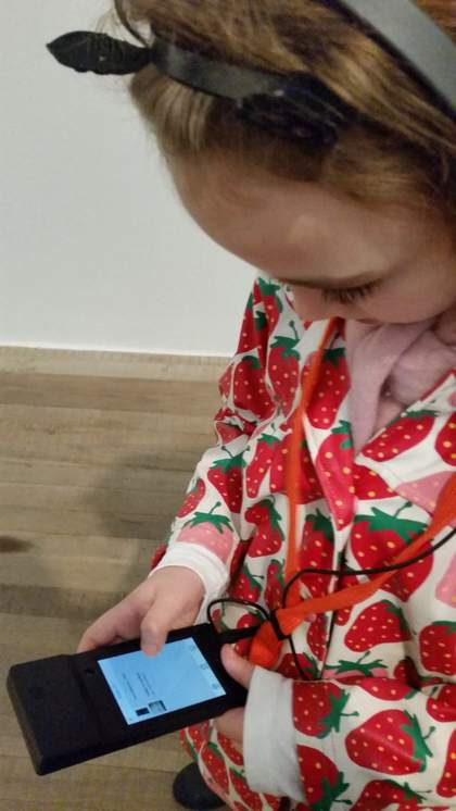 The reviewer's sister listening to an audio guide