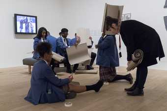 Photograph of a schools workshop at Tate Modern. Young students making cardboard sculptures in the gallery 