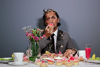 photo of a person covered in cake 