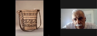 Video conference call screenshot with a single speaker on the right and an image of a woven black and white bag on the left