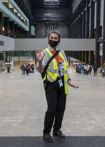A member of Tate security staff inside the Gallery.