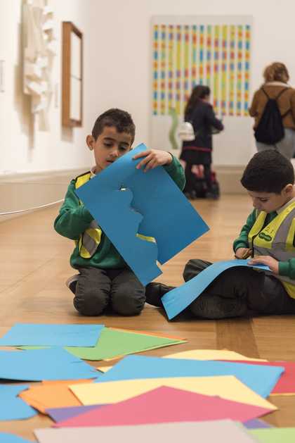 Children cutting coloured paper