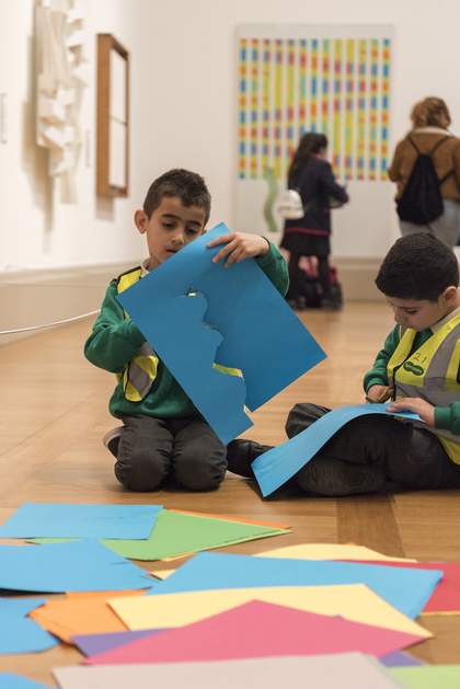 Children cutting coloured paper