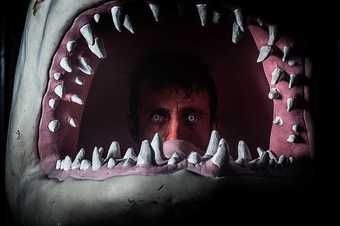 a man in a shark's mouth