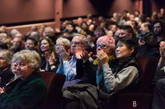 A photograph of a cinema audience