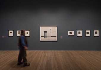 man walking in gallery