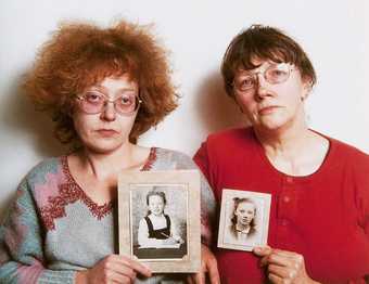 Rosy Martin and Jo Spence undertaking a photo therapy session using childhood portraits from their family albums