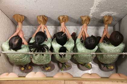 Still from Mika Rottenberg's Squeeze (2010) single channel video installation