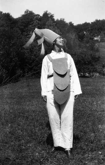 Sophie Taeuber-Arp performing to the sound poem by Hugo Ball in costume and mask