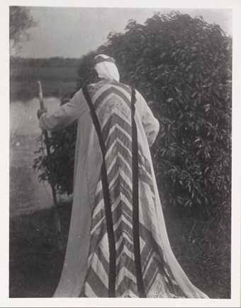 Photograph of Duncan Grant in a costume designed by himself and Vanessa Bell, Tate Archive