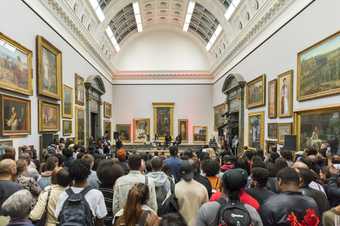 Photograph of a large group of people in Tate Britain's galleries