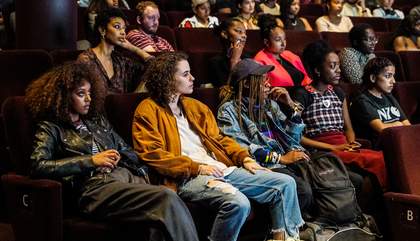 A group of young people watching a film in the Starr Cinema