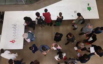 people stand in a gallery
