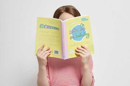 A young child reading a book