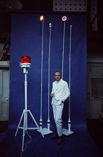 Takis with a selection of his Signals sculptures for the exhibition White Signals at Indica Gallery, London, 1966, photographed by Clay Perry