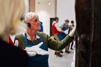 A participant of Tate St Ives' Talking Art event touches a piece of art