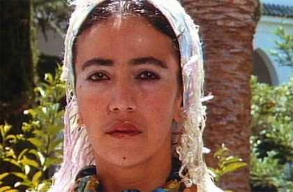 Film still close up of a woman staring into the camera