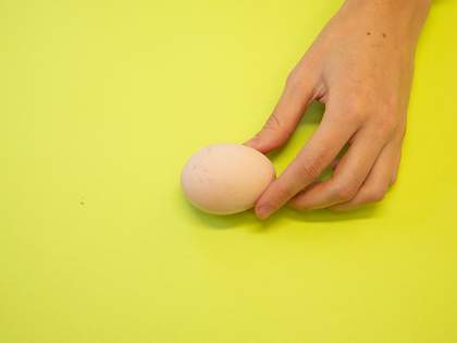 whitened egg in a hand