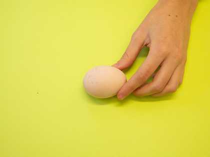 whitened egg in a hand